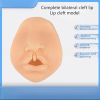 Modèle d'enseignement médical: Modèle bilatéral complet de fente labiale de silicone pour la formation chirurgicale de suture