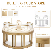 Vitrine à bijoux sur mesure en métal doré avec cadre incurvé et éclairage LED, idéale pour les centres commerciaux et la vente en gros