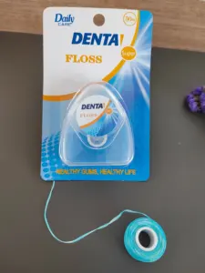 Caja de plástico con hilo dental de aceite de coco azul al por mayor, Embalaje limpio entre los dientes.