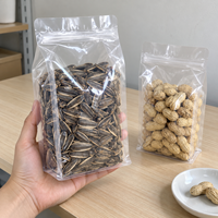 Sachet à fond plat transparent refermable avec fermeture éclair et encoche de déchirement pour l'emballage de dattes, graines de tournesol, cacahuètes et bonbons