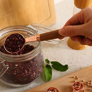 High Quality Metal Rose Gold Plated <b>Measuring</b> <b>Spoons</b> Set with Wooden Handle Round Shape Kitchen Utensils - Product Image 4