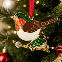 Ornement de Noël Robin en alliage de zinc, tête verte pailletée, poitrine orange, corps brun, émail, branche de houx veinée d'or, strass