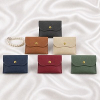 Pochette à bijoux en cuir à bouton-pression, sac de rangement à rabat multicolore pour bagues, colliers et accessoires, pochette créative portable pour pièces de monnaie