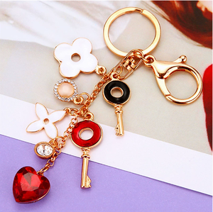 Llavero Creativo y Elegante con Forma <span class=keywords><strong>de</strong></span> Flor, Anillo para Llaves <span class=keywords><strong>de</strong></span> Coche, Colgante para Bolso <span class=keywords><strong>de</strong></span> Mujer, Llavero con Borla <span class=keywords><strong>de</strong></span> Moda, Llaveros <span class=keywords><strong>de</strong></span> Metal con Trébol <span class=keywords><strong>de</strong></span> Cuatro Hojas - Product Image 5