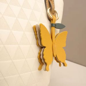 <b>Cute</b> Vibrant Color Butterfly Keychain PU Leather <b>Purse</b> Charm for Handbags Key Charm Unique Accessory - Product Image 1