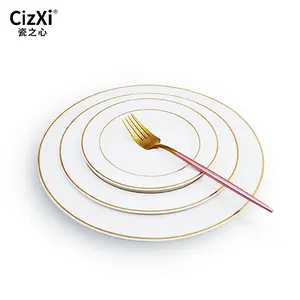 Wholesale modern luxury ceramic white round dinner flat plate dinnerware with gold rim for home hotel wedding party