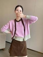 Vente en gros de cardigan en cachemire 100% pour femmes, couleur rose assortie, manches longues, tricoté, style rétro, ensemble de pull et de veste à manches courtes.