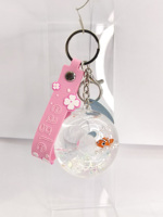 Fabricant OEM ODM, Vente en gros : Porte-clés mini donut créatif et original, avec paillettes, sequins et flotteur aquatique à sable mouvant, idéal comme souvenir, cadeau ou jouet