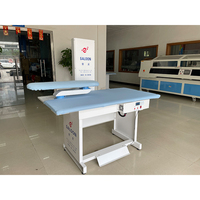 Table de repassage industrielle à moteur haute efficacité avec système de repassage à la vapeur et machine d'inspection de tissus entièrement automatique pour la Russie