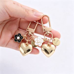 Fashionable Alloy <b>Heart</b>-<b>Shaped</b> Keychain,Cute Pearl Camellia Pendant Headphone Cover <b>Bag</b> Decoration - Product Image 1