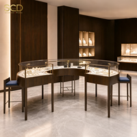 Maßgefertigte Schmuck-Vitrine Gebogene Inseltheke Glas-Schaukasten Einzelhandels-Displaymöbel Ladeneinrichtung mit LED-Beleuchtung