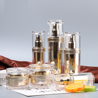 Vente en gros d'usine, flacon cosmétique de luxe en acrylique rond doré personnalisé