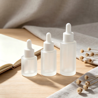 Flacon d'essence liquide de 30 ml, flacon cylindrique à épaule plate, flacon liquide en verre de 20 ml, huiles essentielles emballées, flacons vides.