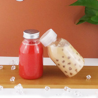 Bouteilles en plastique transparentes jetables rondes pour boissons froides en gros, bouteilles en plastique PET transparentes pour jus avec couvercle en aluminium