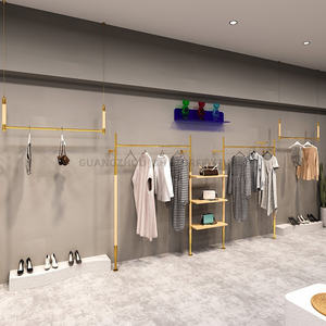 Gli scaffali dorati della <span class=keywords><strong>parete</strong></span> dell'esposizione dello scaffale di esposizione dei vestiti fissato al muro della Boutique appendono l'acciaio inossidabile per il negozio di abbigliamento - Product Image 3