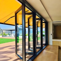 Système de porte en verre minimaliste en alliage d'aluminium Porte pliante pour balcon extérieur