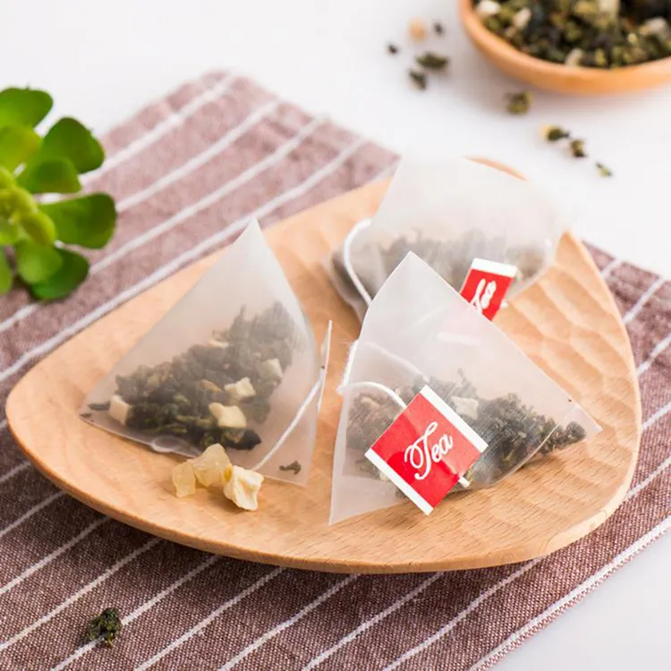 लोगो के साथ Biodegradable मक्का फाइबर पीएलए पुन: प्रयोज्य नायलॉन चाय बैग, चाय फिल्टर के साथ पिरामिड बैग ड्रा स्ट्रिंग, कस्टम खाली चाय बैग