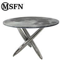 Table à manger moderne Moon, base en acier inoxydable poli en forme de X, plateau en verre artistique, élégante, pour hôtel, villa, restaurant