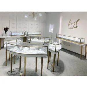 Quioscos de exhibición de joyería de Metal, diseño de lujo para tienda Interior, armario de acero inoxidable, vidrio redondo