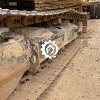 Excavatrice compacte sur chenilles d'occasion CAT 310 avec moteur puissant et performances hydrauliques fluides