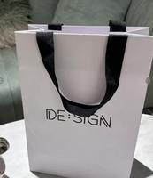 Vente en gros Sac en papier de luxe imprimé personnalisé pour vêtements et bijoux avec papier d'art avec logo de marque et poignée promotionnelle