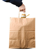 Emballage en papier kraft de luxe personnalisable conçu en usine, sac à provisions noir brun blanc avec logo pour la manipulation de cadeaux artisanaux