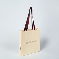 Sac cadeau réutilisable écologique Yu Mo avec poignées découpées en carton blanc et papier kraft pour exposition