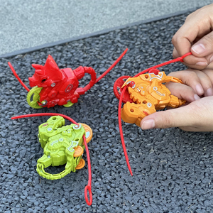 Vente en gros <span class=keywords><strong>Lanceur</strong></span> drôle en forme de dinosaure pour garçon Toupies à tirer Jouet gyroscopique à tirer - Product Image 2