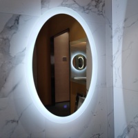 Cermin Kamar Mandi Modern Tanpa Bingkai dengan Lampu LED di Belakang Bentuk Oval Lampu Belakang Sakelar Sensor Sentuh Suhu Warna yang Dapat Disesuaikan IP44
