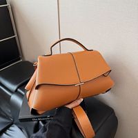 Sac à main élégant pour femme 2026, style français, en cuir PU, avec fermeture éclair, détails à pompons, bandoulière en polyester, rabat élégant