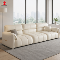 Canapé en cuir pleine fleur de style italien minimaliste, moderne et épuré, couleur crème, luxe léger, modèle Oreilles d'éléphant, pour petit appartement