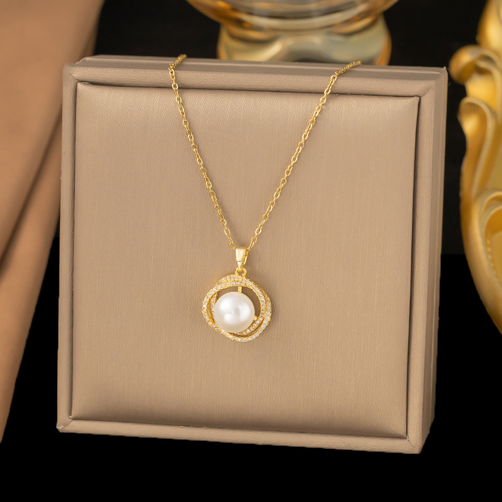 Diamond round pearl pendant on stainless steel necklace