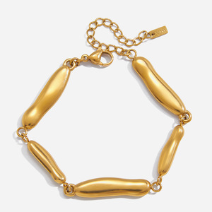กำไลข้อมือสแตนเลสสีทองทรงเส้นตรงแบบไม่สมมาตรรูปทรงหยดน้ำ เครื่องประดับสำหรับผู้หญิง ของขวัญ ผลิตจากเมืองอี้หวู่ - Product Image 1