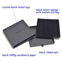 Boîte de tiroir en papier mat noir emballant le logo déjoué noir avec une éponge de velours de coupe personnalisée
