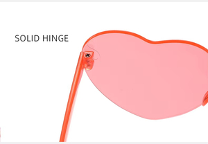 Vente en gros Lunettes de soleil mode unisexes sans monture en forme de cœur Transparent PC Frame UV400 Confortable One Piece Sun Eyewear Candy - Product Image 5