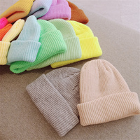 Caramelo Color sólido neón a granel de alta calidad personalizado etiqueta privada Oem bebé invierno niños sombrero niños colorido gorro de punto