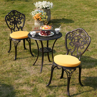 Chaise européenne vintage en aluminium moulé, sculptée à motif floral orchidée, bronze antique, ajourée, pour extérieur, patio, bistrot, jardin, atelier, résistante aux intempéries