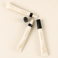 Tube souple vide personnalisé pour brillant à lèvres avec embout applicateur en silicone et capuchon noir – Emballage cosmétique pour baume à lèvres