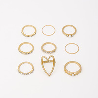 Ensemble de bagues transfrontalières européennes et américaines Combinaison d'or Bague commune Creative Fashion Love Point Diamond 9-Piece Set