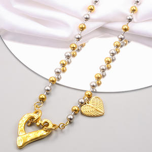 Demande catalogue Collier unisexe <span class=keywords><strong>uno</strong></span> de 50 bijoux en acier inoxydable plaqué or pour femmes avec pendentif en perles colorées avec cadenas en forme de coeur vente en gros - Product Image 1