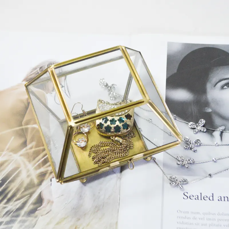A glass box with a miniature ring Jewelry box in the shape of bread in size