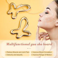 Planche de massage Gua Sha multifonctionnelle filaire Kinwong GSB25019 en métal ajouré en forme de papillon pour le visage et le corps