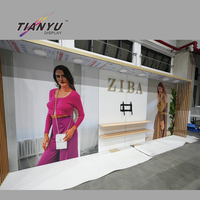 Support d'affichage robuste et durable pour événements, idées de présentoirs personnalisés pour salons professionnels de vêtements, comptoirs de stand.