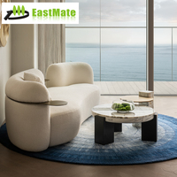 Ensemble de canapé en tissu incurvé et table basse en marbre pour salon, idéal pour appartements modernes et hôtels