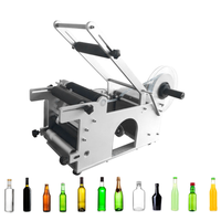 2025 Étiqueteuse de bouteilles semi-automatique Imprimante de code de date Étiqueteuse manuelle à manchon thermorétractable Matériau d'emballage en bois