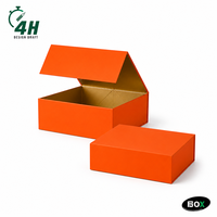 Boîte cadeau magnétique personnalisée FUSSEN, extérieur orange, intérieur doré avec doublure en feuille d'aluminium pour un design d'emballage cosmétique de luxe