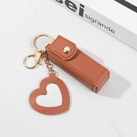 Étui à rouge à lèvres en cuir PU léger avec miroir en forme de cœur, pochette durable pour baume à lèvres, maquillage de voyage pour femmes
