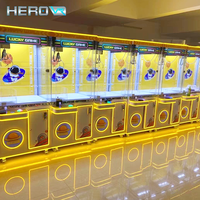 Machine à griffes HEROVR en promotion pour enfants, paiement par pièces/billets/cartes de crédit, écran tactile, capacité 360-600, certifiée CE