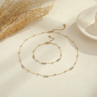 Ensemble collier et bracelet superposés en acier inoxydable plaqué or 18 carats avec breloque soleil et zircon pour femme, style plage