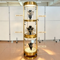 Vitrine rotative ronde en métal doré pour bijoux, présentoir en verre verrouillable à 3 niveaux avec éclairage LED pour la vente au détail de bijoux et de montres